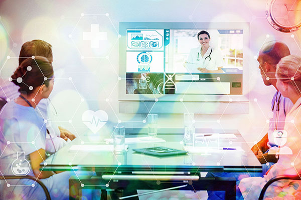 Composite image of team of doctors having a meeting